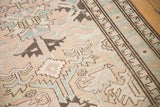 Distressed Serab runner detail with geometric patterns in beige, pale blue, and coffee brown.