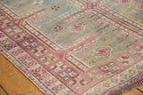 Distressed hand-knotted Oushak rug runner showcasing raspberry red geometric borders and sky blue field.
