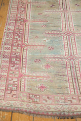Distressed Oushak runner with faded raspberry and sky blue geometric patterns, ivory fringe.