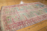Textured raspberry red and sky blue geometric pattern on a distressed Oushak rug runner.