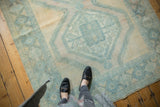 Vintage distressed Afshar carpet showing even wear, faint foundation, pale blue, antique ivory.