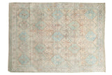 Distressed vintage Afshar rug with allover serrated diamond pattern in ivory, pale blue, faded peach.