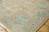Distressed geometric Afshar rug with faded ivory, sky blue, and peach serrated diamond motifs.