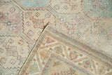 Distressed pile texture with faded tones, revealing hand-knotted reverse of an Afshar rug.