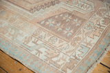 Distressed vintage Serab runner with geometric patterns in faded beige, ivory, and pale blue.