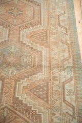 Stepped geometric motifs on a distressed vintage Serab runner, with softened beige and powder blue tones.
