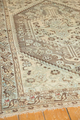 Distressed geometric motifs in antique ivory, pewter, powder blue with fringe.