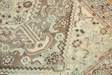 Distressed vintage Shiraz geometric pattern in antique ivory, pewter, and powder blue.
