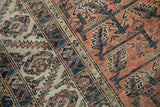 Playful Malayer rug vinery and boteh patterns, ivory to blush transition with wear.