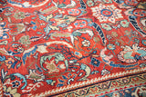 Cherry red Persian Mahal carpet featuring scrolling cloudband vinery, double floral motifs, and low pile.