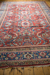 Low pile texture, scrolling floral vinery, and patterned border detail of a Mahal rug.
