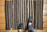 Detailed vintage Moroccan Kilim rug with varied striated brown and ivory striped bands.