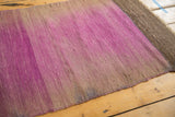 Textured weave of the vintage Turkish Kilim rug, showing intentional fade of pale purple and brown.