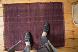Textured vintage Turkish Kilim rug in rich wine aubergine burgundy with rewoven foundation.