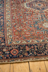 Detailed view of a vintage Karaja's indigo border and intricate, geometric, cherry red field.