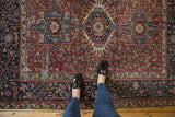 Classic vintage Karaja rug with intricate geometric patterns, central medallion, and light areas of wear.