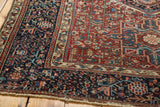 Vintage Karaja rug corner, intricate geometric patterns in black cherry red, indigo, and fringe.