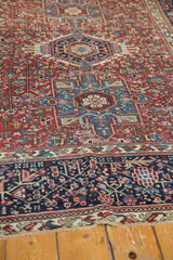 Vintage Karaja rug with black cherry red geometric field, navy blue border, and fringe.