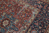 Karaja rug detail: intricate geometric patterns in black cherry red, indigo blue, and light wear.