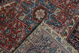 Deep cherry red and indigo blue geometric patterns with hand-knotted reverse on a Karaja rug.