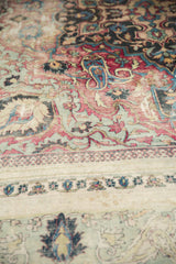 Close-up of distressed antique Khorassan carpet, with faded floral motifs and Laleh Abassi border.