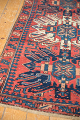 Detail of hand-knotted vintage Karaja runner, brick red, navy, and ivory geometric design.