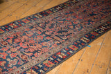 Angled view of the vintage Malayer runner, displaying its rich Herati pattern and low pile.