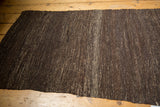 Vintage Turkish Kilim rug's hand-woven texture with subtle warp and weft definition.