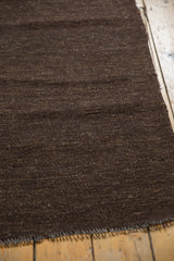 Speckled dark chocolate brown undyed wool weave and secured ends of vintage Turkish Kilim.