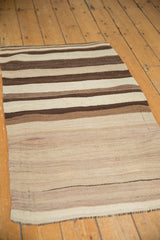 Vintage Turkish Kilim rug with horizontal bands of striated ivory, coffee, and dark chocolate.