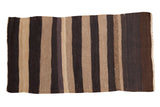 Vintage Turkish Kilim runner with repeating horizontal bands of beige and dark brown abrashes.