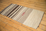 Vintage Turkish Kilim runner's ivory and brown striped weave with textured flatweave and finished edge.