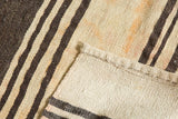 Hand woven texture of distressed Turkish Kilim rug, showing striped front and plain back.