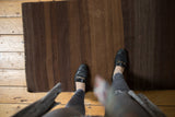 Striated horizontal bands in varying coffee and dark chocolate shades on a Kilim rug.