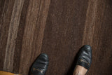 Vintage Turkish Kilim runner featuring flat woven coffee brown stripes and rich abrash, underfoot.