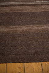 Striated coffee brown and dark chocolate horizontal bands on vintage Turkish Kilim rug.