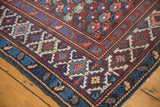 Close-up of a Caucasian Kuba runner corner with geometric patterns, highlighting visible foundation.