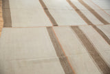 Turkish kilim patchwork, ivory and coffee brown banded stripes with terracotta stitching.