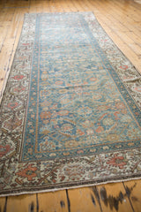 Distressed vintage Malayer runner, classic floral border and sky blue Herati motif field.