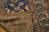 Folded vintage Kurdish runner showcasing hand-knotted back and colorful Veramin pattern.