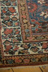 Veramin pattern in navy, madder red, and beige, with an even pile and visible fringe.