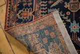 The hand-knotted foundation and secured terracotta selvedge of a vintage Mehreban rug runner.