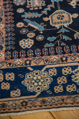Delicate vinery and bird motifs on the even, low pile of a vintage Persian Mehreban rug runner.