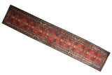 Vintage Northwest Persian runner featuring brick red ground, single column quatrefoil pattern, 2'10