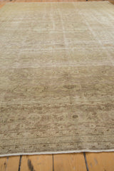 Distressed texture and tone-on-tone floral pattern of vintage Sivas rug in ivory and beige.
