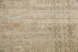 Distressed vintage Sivas carpet pile, showing worn floral motifs and exposed knot heads in beige tones.