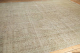 Distressed aesthetic and tone-on-tone floral motifs on the vintage Sivas carpet in muted beige.