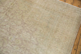 Vintage Sivas carpet's distressed aesthetic, showing mostly even wear and tone-on-tone floral design.