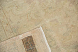 Sivas rug corner showing distressed pale pile, hand-knotted foundation, and dark processing mark.