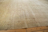 Distressed vintage Sivas carpet with mostly even wear, faded floral design, subtle ivory and beige.